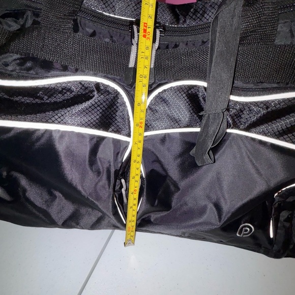 Black Duffel Bag with White Accents and Modern Design - Picture 9 of 13